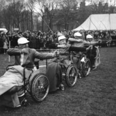 <span class=heading><b>Disability and Community </b> by Angela Turner (History)</span><br />The image shows paraplegic archers in a contest at the Miners’ Gala Day in Newtongrange, 1960s. This illustrates key aspects of a current Wellcome Trust funded project at The University of Strathclyde concerned with Disability and Industrialisation. Coal mining was one of the most dangerous occupations in the 20th century with high levels of industrial injury and disease. Research has revealed strong community networks and how mining communities sought to mediate the impact of disability on miners and their families.<br /><span class=small>Image: © 2014 Angela Turner</span>