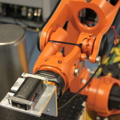 <span class=heading><b>Robots Work In Nuclear Environments</b> by Rahul Summan</span><br />In nuclear power stations, evaluating the structural integrity of
components is too dangerous for human operators. Through an EPSRCfunded
Impact Acceleration Account project, the Centre for Ultrasonic
Engineering has successfully developed a way to search for cracks and
near-surface defects in nuclear product containers. The objective of this
project, carried out in conjunction with Eddyfi (sensor manufacturer)
and National Nuclear Laboratory, was to demonstrate the benefits of
 
robotic technology for increased throughput, accuracy and reliability.<br /><span class=small>Image: © 2016 Rahul Summan</span>.  <span class=small>Collaborators: William Jackson, Charles Macleod, Maxim Morozov, Gareth Pierce, Carmelo Mineo</span>