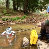 <span class=heading><b>In case of emergency - innovate!</b> by Jen Roberts</span><br />Field research often requires a bit of creative thinking. To measure natural CO2 leakage from rocks on this riverbed in Victoria (Australia), we niftily adapted our equipment to obtain the best results. Our research is developing methodologies to measure CO2 leakage, enabling precise monitoring of carbon capture and storage (an important technology to tackle climate change), which can provide reassurance for regulators and communities, and help to shape international policy.<br /><span class=small>Image: © 2018 Jen Roberts</span>.  <span class=small>Collaborators: Dr Linda Stalker, Dr Matt Myers and Cameron White (CSIRO)</span>