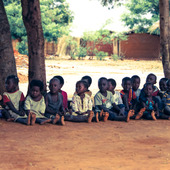 <div><div style="float:left;padding-left:5px;width:70%"><span class=heading><b>Tithandizane Orphan Care Centre </b> by Magnus Currie (Electronic and Electrical Engineering)</span><br />Orphans in rural Malawi wait patiently whilst University of Strathclyde researchers meet with the Village Chief and local women who look after the orphans.  
The biogas system can be seen under construction in the background which, once complete, will provide clean energy for the community.
This will reduce the burden on the orphan carers, provide more timely meals for the orphans and reduce deforestation - a serious problem throughout Malawi.<br /><span class=small>Image: © 2014 Magnus Currie</span></div><div style="float:right;padding-right:5px;"><iframe width="100%" height="166" scrolling="no" frameborder="no" src="https://w.soundcloud.com/player/?url=https%3A//api.soundcloud.com/tracks/146888399&color=ff5500&auto_play=false&hide_related=false&show_artwork=true"></iframe></div></div>