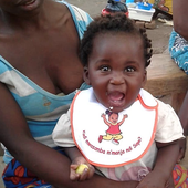 <span class=heading><b>Helping mums form healthy habits</b> by Tracy Morse</span><br />In rural Malawi, Eliza wears a bright bib that helps to remind her mum to wash her hands with soap before she feeds her. Aimed at reducing disease transmission, the Hygienic Family trial – a programme of activities and prompts – was developed and delivered in partnership with the University of Malawi WASHTED Centre and community members. The intervention has so far reduced diarrhoea by over fifty percent.<br /><span class=small>Image: © 2021 Tracy Morse</span>.  <span class=small>Collaborators: Kondwani Chidziwisano, Rossanie Malolo, Mindy Panulo</span>