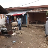 <div><div style="float:left;padding-left:5px;width:70%"><span class=heading><b>From contested to common grounds</b> by Aisha Abubakar</span><br />Adam looks on proudly at his home/blacksmith-workshop at a city-centre
slum in Abuja. He is among a continuously growing population residing
in different slum types within cities of the global south. Interestingly,
both city system and slum have the same comparative focus: prosperity.
Identifying and analysing relative features, in slums, that either impede
or enhance prosperity is imperative, as motive and design guide, for
better targeted integrative slum management programs.<br /><span class=small>Image: © 2015 Aisha Abubakar</span>.  <span class=small>Collaborators: Dr Ombretta Romice; Dr Ashraf salama</span></div><div style="float:right;padding-right:5px;"><iframe width="280" height="170" src="https://www.youtube.com/embed/Tj3XcTrEd_Y" frameborder="0" allowfullscreen></iframe></div></div>