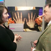 <span class=heading><b>Images of Research</b> by Guy Hinks</span><br /><p class=int>Winner of her category Public and Urban Health, Kirsty Ross discusses her image with Professor Sir Jim McDonald.</p><span class=small>Image: © 2022 Guy Hinks 2015</span>