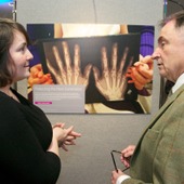 <span class=heading><b>Images of Research</b> by Guy Hinks</span><br /><p class=int>Winner of her category Public and Urban Health, Kirsty Ross discusses her image with Professor Sir Jim McDonald.</p><span class=small>Image: © 2025 Guy Hinks 2015</span>