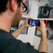 <span class=heading><b>Drygate Brewery</b> by Guy Hinks</span><br /><p class=int>Visitors use augmented reality technology through the ’Aurasma’ app to watch digital stories created by the entrants for 2015. </p><span class=small>Image: © 2025 Guy Hinks 2015</span>