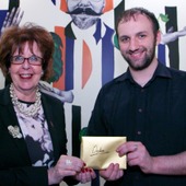 <span class=heading><b>Drygate Brewery</b> by Guy Hinks</span><br /><p class=int>Bailie Liz Cameron presenting prize to Declan Bryans for his image "Fully Harnessing Renewable Energy".</p><span class=small>Image: © 2024 Guy Hinks 2015</span>