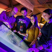 <span class=heading><b>Explorathon</b> by megan</span><br /><p class=int> </p>
<p class=int>The team from the Strathclyde Institute of Pharmacy and Biomedical Sciences looking at Jana Hiltner’s entry on the touchscreen.</p>
<p class=int> </p><span class=small>Image: © 2015 megan</span>