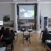 <span class=heading><b>Images of Research</b> by Rachel Clark</span><br /><p class=int>Our audience enjoying a short video about the Images of Research Competition.</p><span class=small>Image: © 2024 Rachel Clark</span>