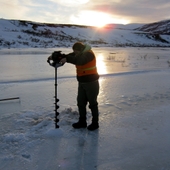 <span class=heading><b>Augers well.......</b> by Keith Torrance (Civil & Environmental Engineering)</span><br />Surface water quality shows significant temporal variation and must be sampled in all seasons. Reaching water during the Alaskan winter is a challenge when rivers are under several feet of ice. Fortunately, ice fishers have already solved this problem using motorised ice augers to make short work of drilling through the ice. This photo was taken near Iliamna, Alaska, in January 2013. <br /><span class=small>Image: © 2013 Keith Torrance</span>